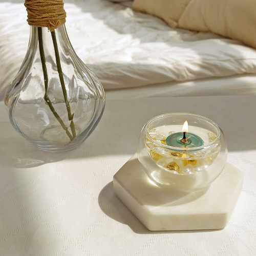 a candle and a vase