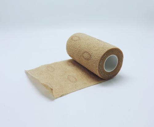 Self adhesive elastic compression bandage with a ◎-shaped visual indicator