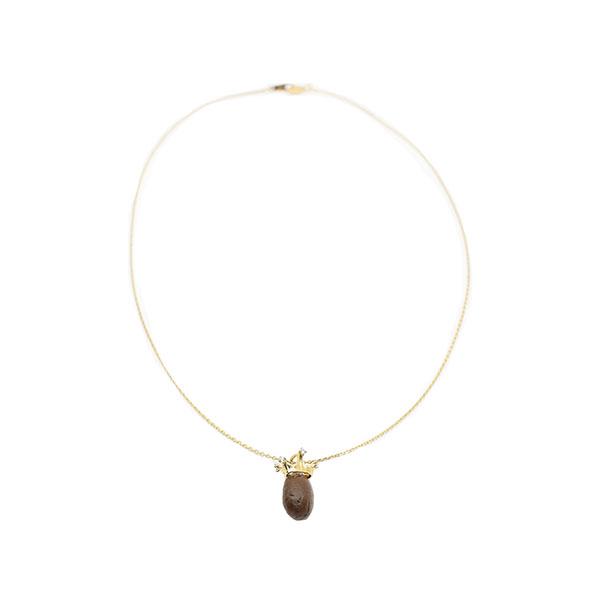 a gold filled choker necklace with a brown stone