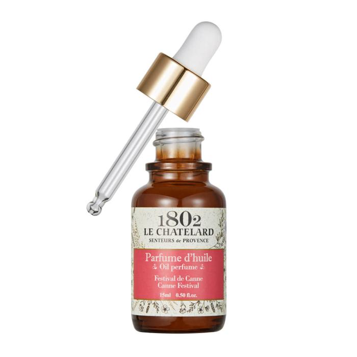 1800 Le Chiffre Perfume Oil and a dropper on a white background