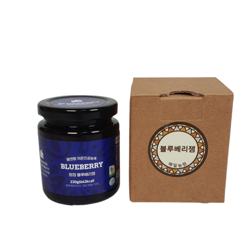 blueberry jam in a glass jar and a cardboard box