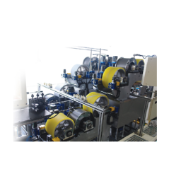 This facility is a device for applying a solution containing flux (Zn) to the surface of an aluminum extrusion tube using a roller, drying, and winding.