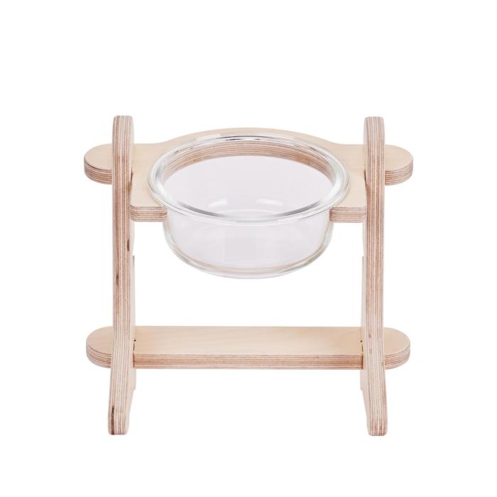 a wooden stand with a glass bowl on it