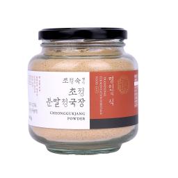 a glass jar with a black lid