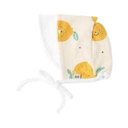 organic cotton muslin face mask with lemons on one side and a banana on the other side