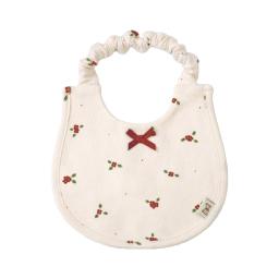 a white bib with a red cross on the front