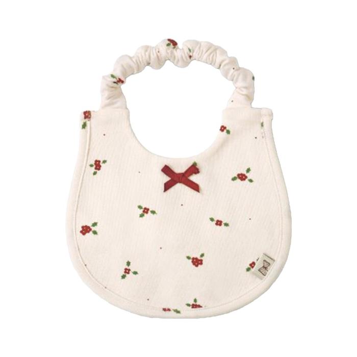 a white bib with a red cross on the front