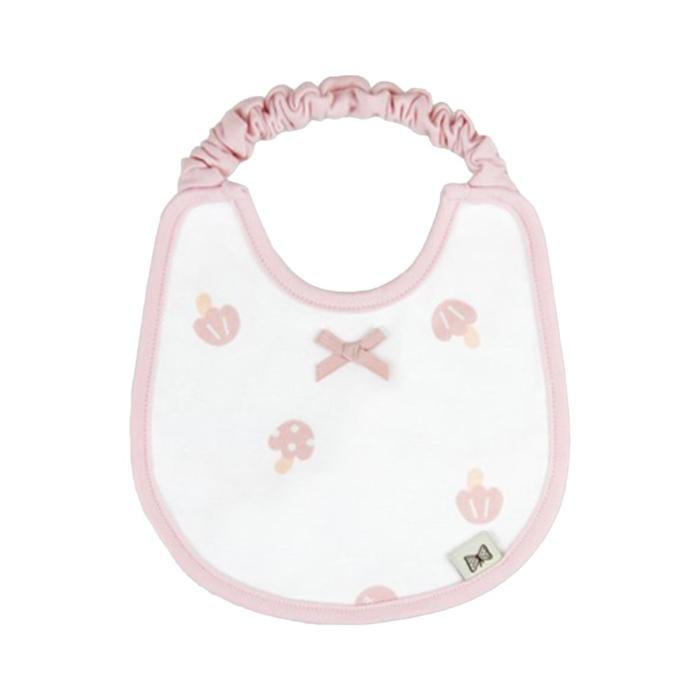 a white bib with pink flowers and a pink ribbon