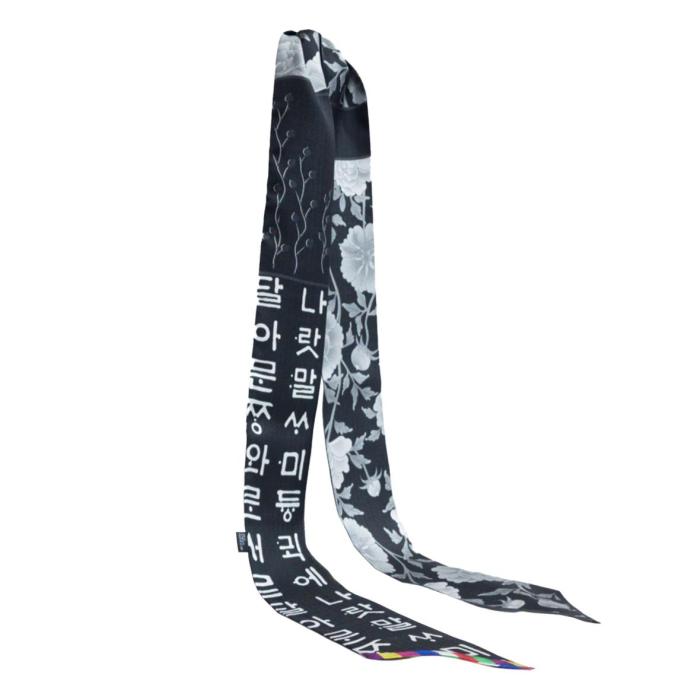 a black and white scarf with the words