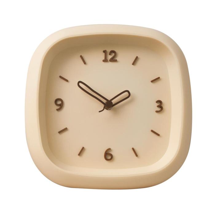 the clock with a white face and black hands