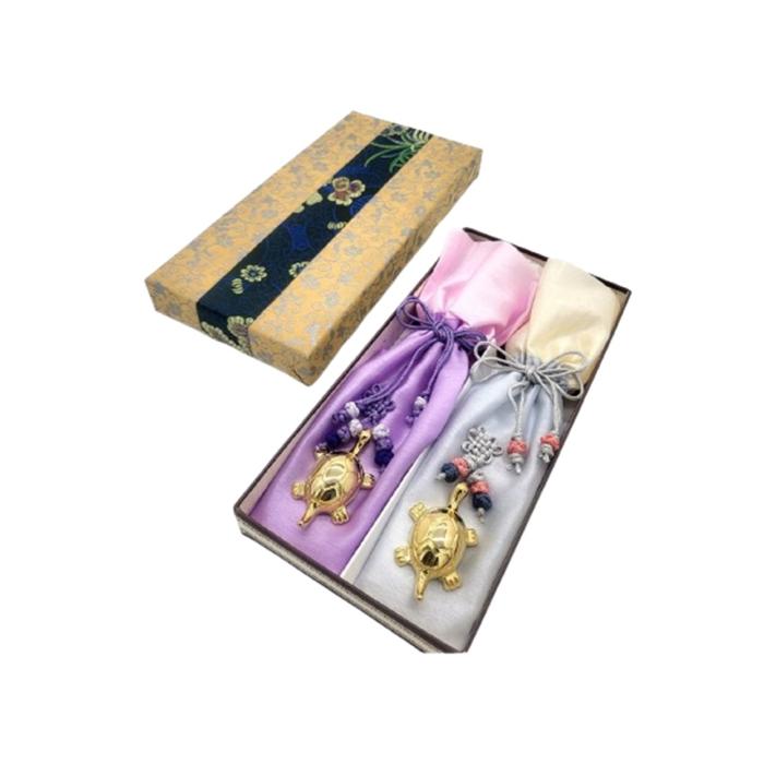 a set of three silk ribbons