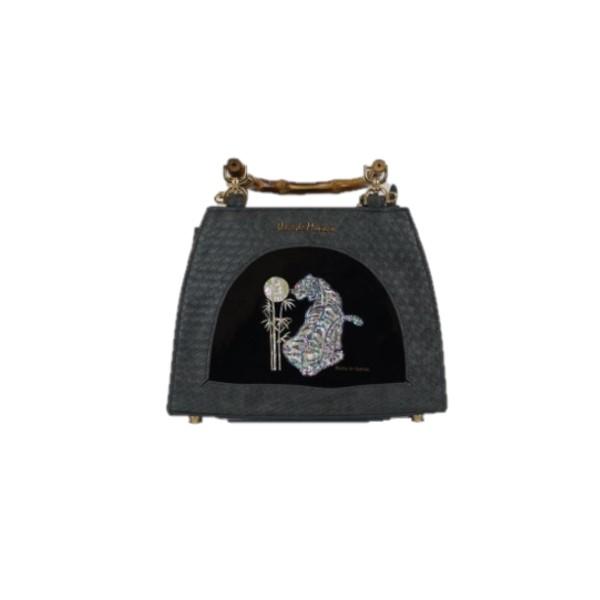 the small black bag with a cat and a flower on the front