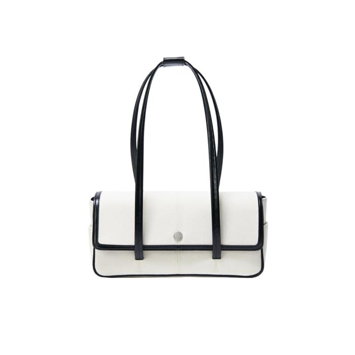 white leather handbag with black handles