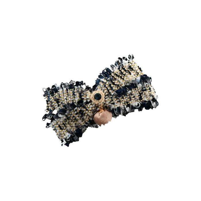 a black and gold sequin bow hair clip