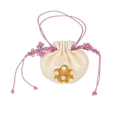 a white pouch with a gold flower and pink lace