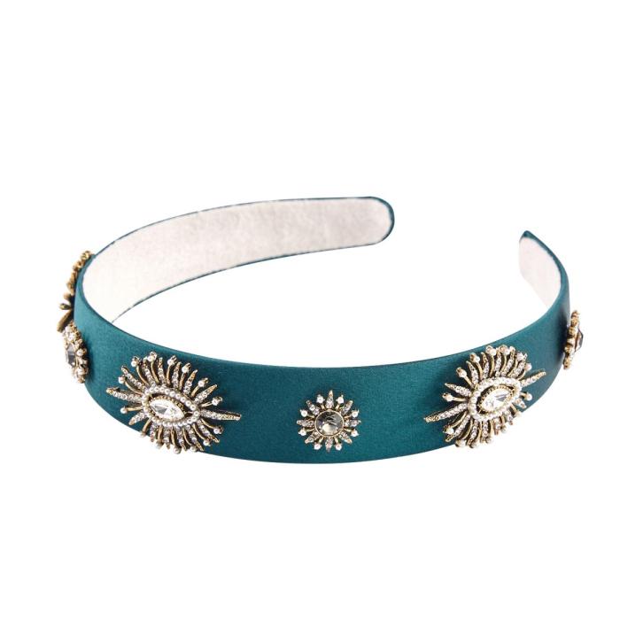 teal leather headband with gold sunbursts and eyelets