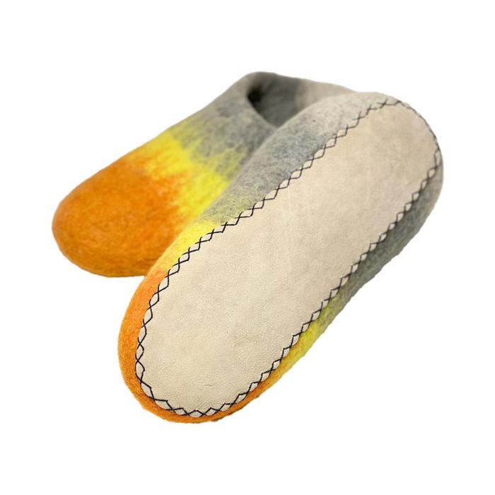 a pair of grey and yellow moccasins
