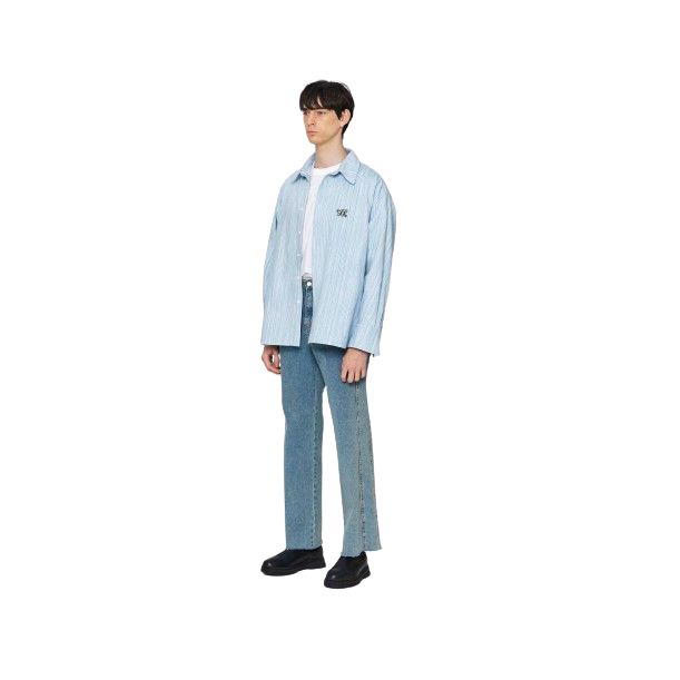 a male model wearing a light blue denim jacket and light blue jeans