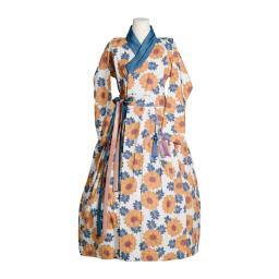 a long sleeved maxi dress with a blue floral pattern