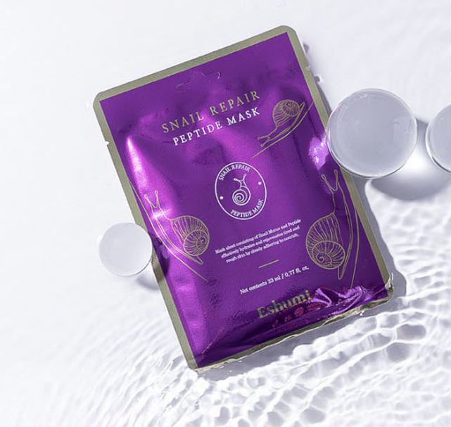 Eshumi Mask Pack 3Type

1.	Collagen Repair Cica Mask : 
When protection is needed due to frequent outdoor activities
Contains Centella asiatica extract, which has long been used medicinally through traditional therapy, and collagen, a skin component.

	Centella asiatica extract
The main ingredients in the bottled water extract are asiaticoside, Asiatic, acid,madeccassic acid, and madecassoside, which are substances with skin regenerative properties and have been reported to have an effect on improving extracellular matrix production.

	Collagen
Collagen, a component of skin, is effective against skin aging because it gives strength and elasticity to the skin and protects it from external stimuli.


2.	Snail Repair Peptide Mask : 
When dry skin needs moisturizing . Contains 5 types of peptides. Black Snail. Anti-aging 
 Contains 5 peptides (Copper Tripeptide-1, Oligopeptide-32, Oligopeptide, Acetyl Hexapeptide-8, Palmitoyl Pentapeptide-4) and Black Snail

	Palmitoyl Pentapeptide
According to research approved by the World Congress of Dermatology, it induces the production of collagen and elastin.
	Black Snail
Black snails contain about 1.5 times more protein than regular snails, and snail slime prevents aging/skin regeneration and minimizes skin irritation.



3.	Multivitamin Glutathione Mask : 
When tired skin needs vitality. 10 vitamins. White jade injection ingredient. Contains glutathione. Prevents pigmentation

	10 Vitamins
Contains vitamins B5, F, H, A, B6, B9, B1, and B12, including vitamin C and E, and has antioxidant, whitening, moisturizing, wrinkle improvement, and soothing effects.

	Glutathione
Glutathione, a protein made by combining three amino acids, cysteine, glycine, and glutamate, inhibits the production of black melanin in the skin and prevents melanin pigmentation, keeping the skin bright and helping to remove spots, blemishes, and freckles.

Eshumi Mask Pack 3 Type 

	When protection is needed due to frequent outdoor activities
Improve the skin barrier with the cica component of centella asiatica extract and collagen that protects the skin!

	When dry skin needs moisturizing
Recharge with real black snail slime that contains 1.5 times more protein than regular snails!

	When tired skin needs vitality
Make your skin bright and vibrant with 10 types of multi-vitamins and glutathione!


#Skin elasticity #Skin regeneration
#Wrinkle improvement #Blemish improvement