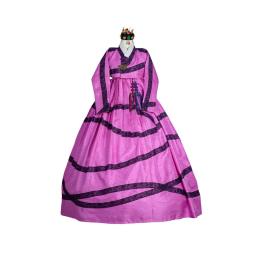 a pink and purple dress with a crown on a mannequin