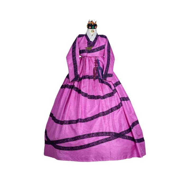 a pink and purple dress with a crown on a mannequin