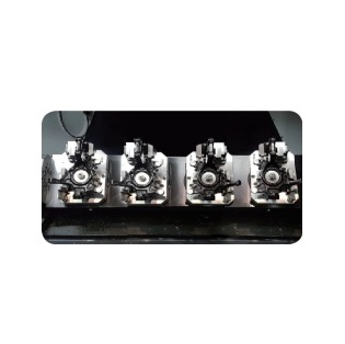 a row of four black and silver typewriter keys