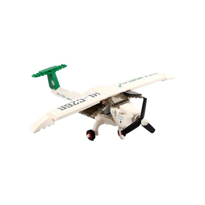 white plastic airplane with green propellers