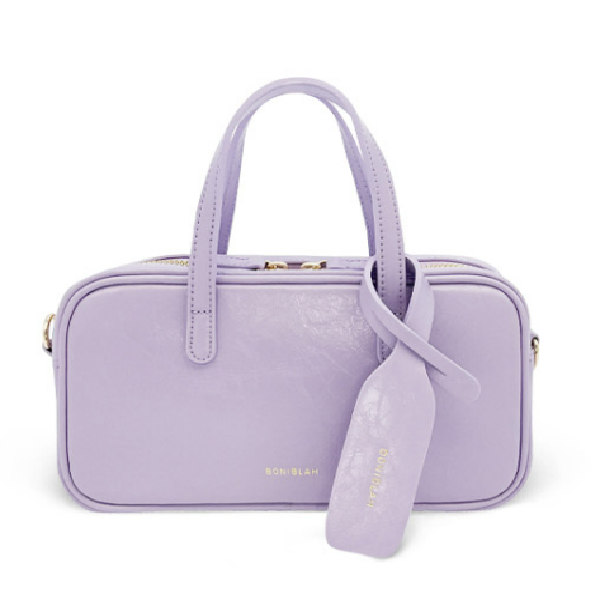 the purple kate spade new york luggage