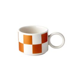 mug with orange and white checkerboard pattern
