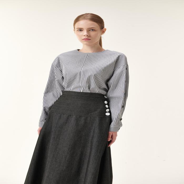 Denim skirt with button on side yoke
36" length
True to size