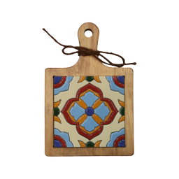 the cutting board with a floral mandala design