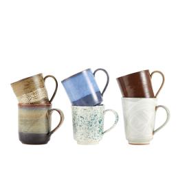 a variety of ceramic mugs