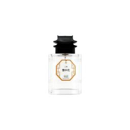 perfume bottle with black cap and white label