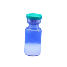 blue glass vial with green cap and blue liquid inside