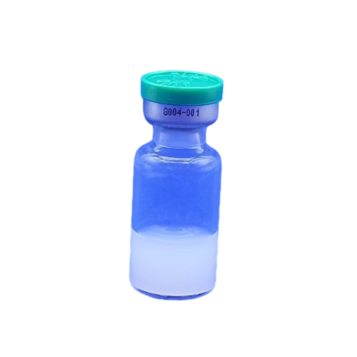 blue glass vial with green cap and blue liquid inside