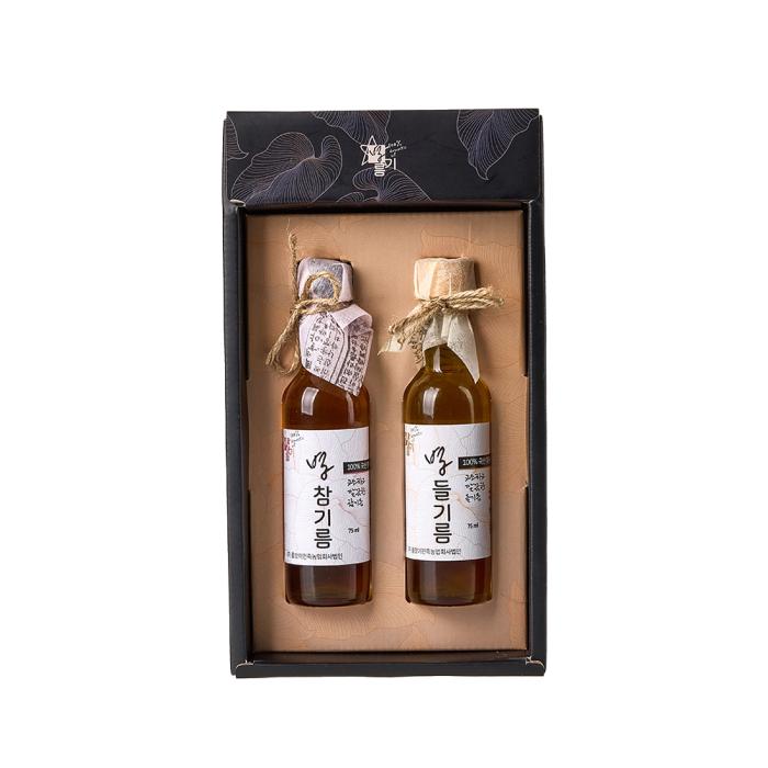 two bottles of honey in a gift box