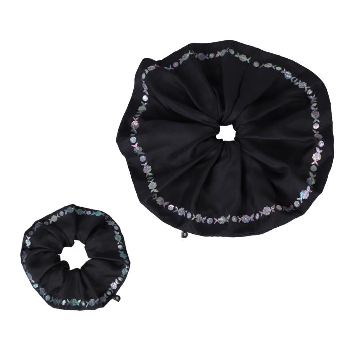 black round shower curtain and ring holder