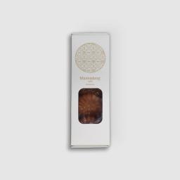 White matte paper packaging featuring a gold traditional Korean emblem.