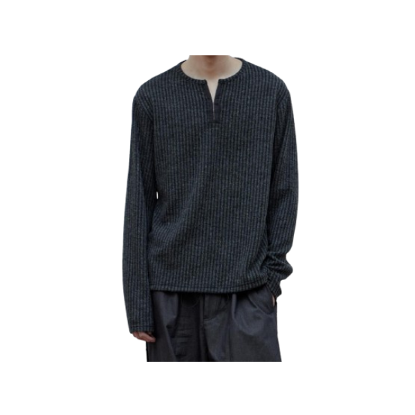 a dark blue knitted sweater with a white collar and black pants