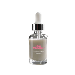 stay young serum in a glass bottle with a white lid and pink label