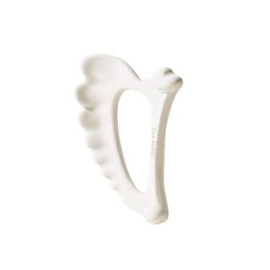 white ceramic irish harp