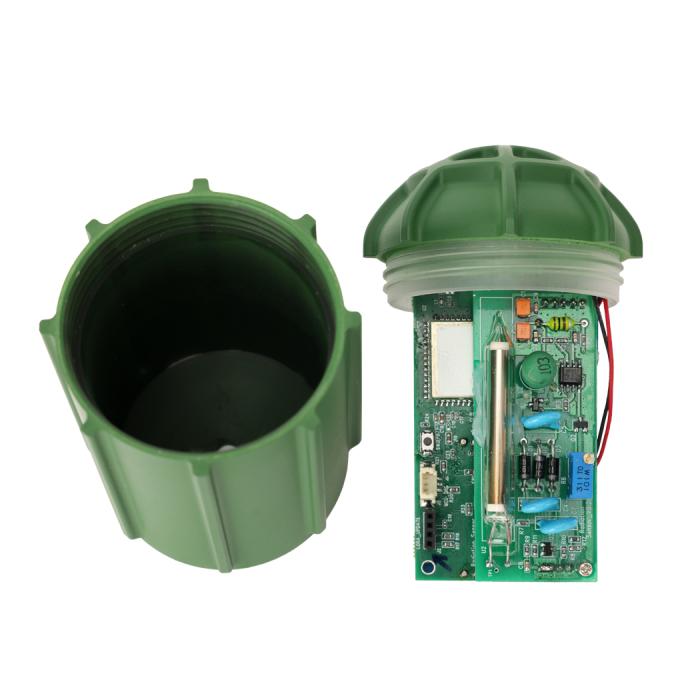 green plastic water tank and circuit board