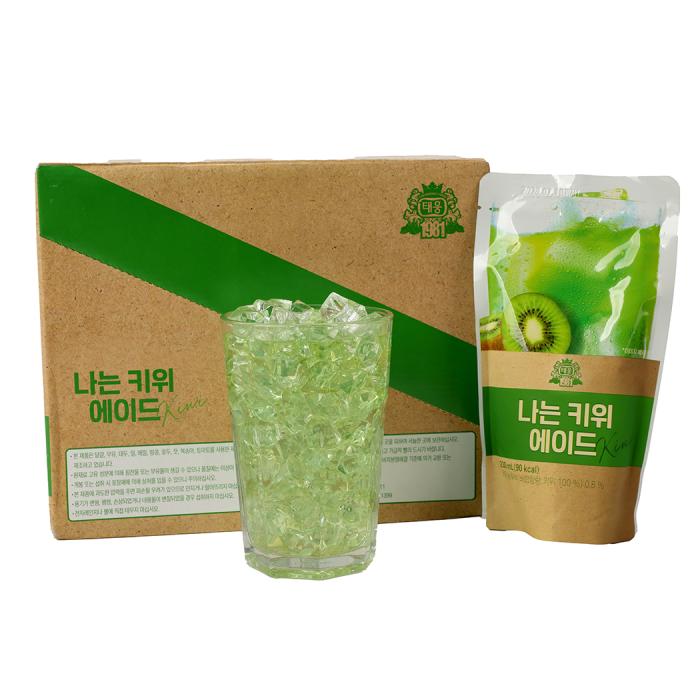 a glass of green tea and a box of green tea bags