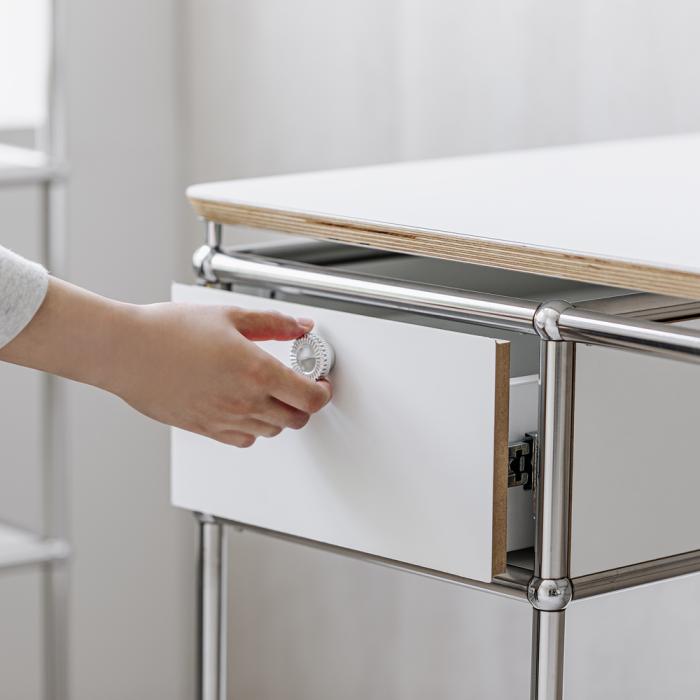 this image stands for: woman opening a drawer