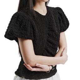 A feminine blouse made from Tencel fabric that has been processed for volume, emphasizing the waist silhouette with a voluminous texture and unique design.