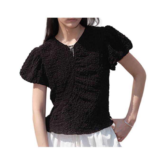 A feminine blouse made from Tencel fabric that has been processed for volume, emphasizing the waist silhouette with a voluminous texture and unique design.