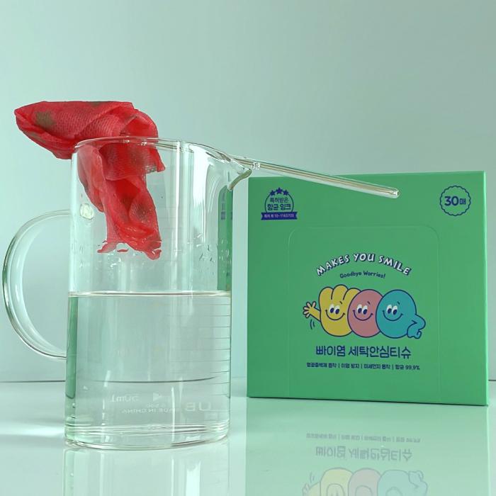 Demonstration of BBye Laundry Care Sheet absorbing red dye from water. Shows effective dye trapping during washing.