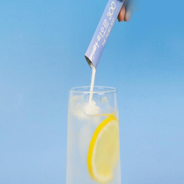 a glass of water and a lemon