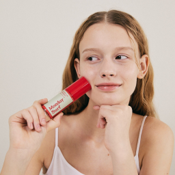 girl applying lip balm